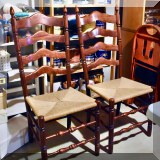 F41. 2 Ladderback chairs with rush seats. 